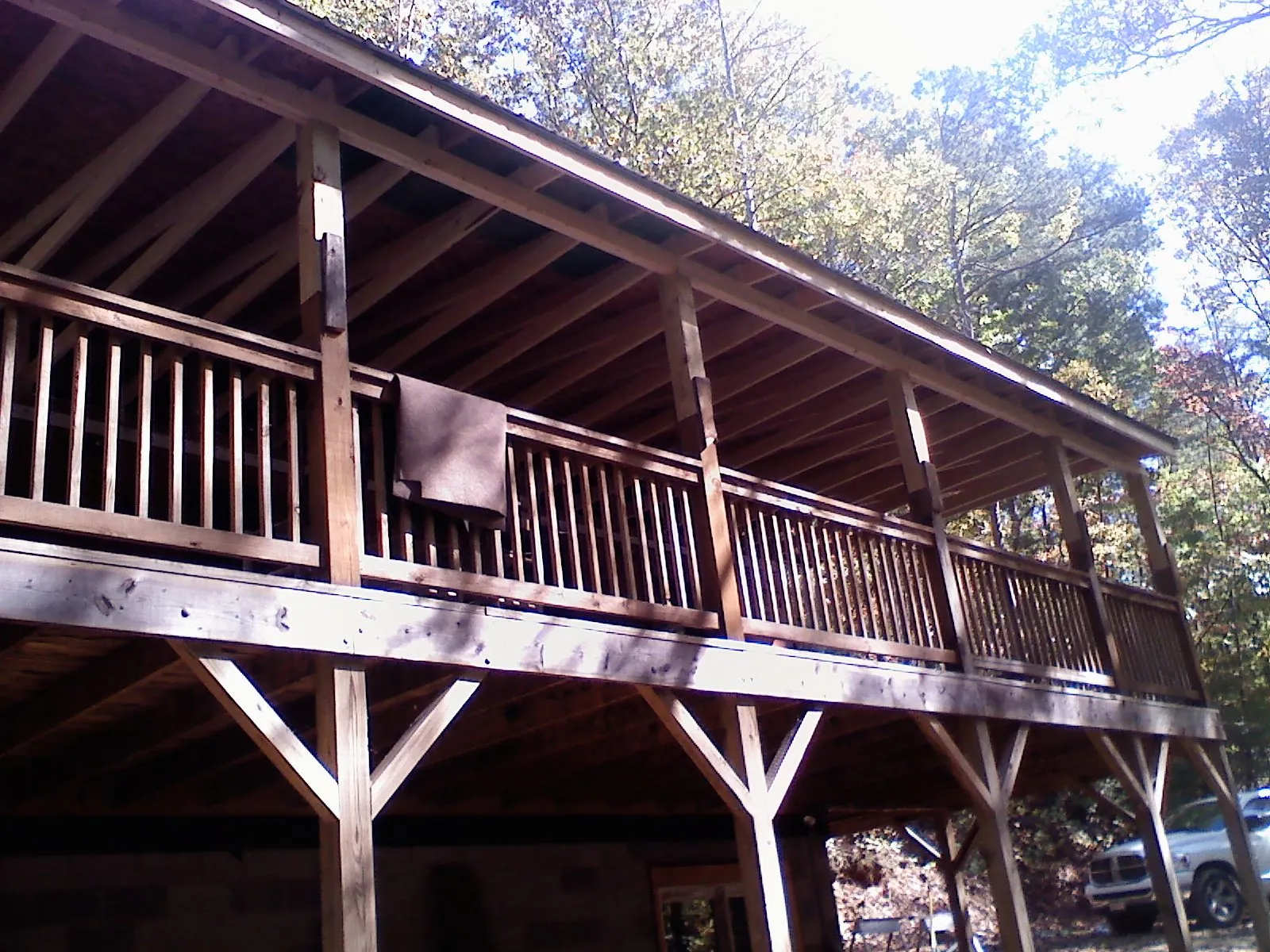 Timber framing under a new elevated porch and deck — Roof Leak Repair in Darien by Roofing Brothers